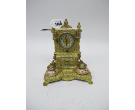 A Late XIX Century Gilt Metal Clock Desk Stand, of architectural form with perpetual calendar, pen rack and pair of ceramic i