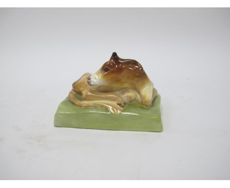 A Royal Worcester Porcelain Model 'Calf', modelled recumbent on an oblong base, designed by Stella Crofts, model No 2896, puc