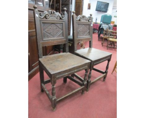 A Pair of XVII Century Joined Oak Back Stools, with finial tops, 'S' shaped rail over a back panel with lozenge decoration, s