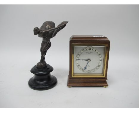 An Elliott Clock, retailed by H.L. Brown and Son Ltd., Sheffield, in a rectangular mahogany case, the silvered dial with chap