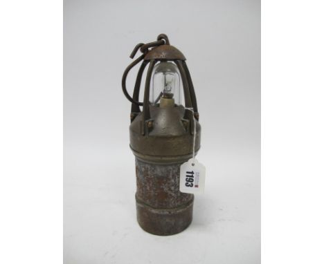 Miners Lamp, brass shoulders and five vertical supports to iron dome, 845 plaque to body  26cm high with handle down.
