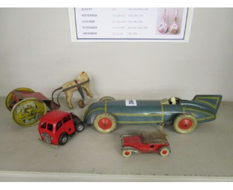 A Burnett Ltd, London tinplate clockwork land speed record car with integral key, a German Tellus tinplate clockwork horse dr