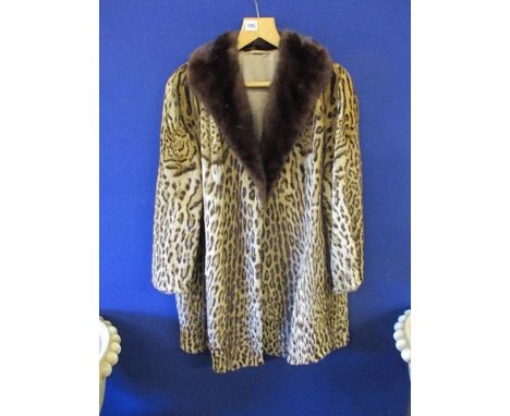 A vintage ocelot thigh-length coat with a mink collar, 33 in length, chest size approximately 42 wide