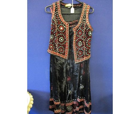 A vintage Baluchi velvet embroidered, full length skirt size 28 waist and a matching waistcoat, size 40