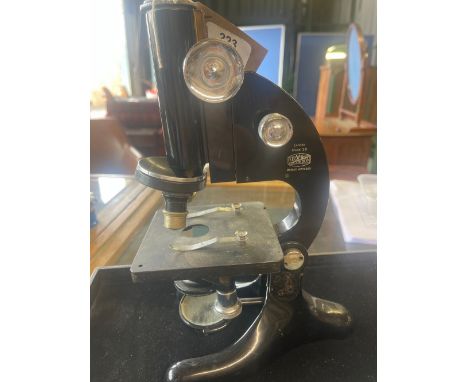 R. &amp; J. Beck Ltd London - Model 29 japanned microscope on triform base, base repaired, serial no.12746, H33cm 