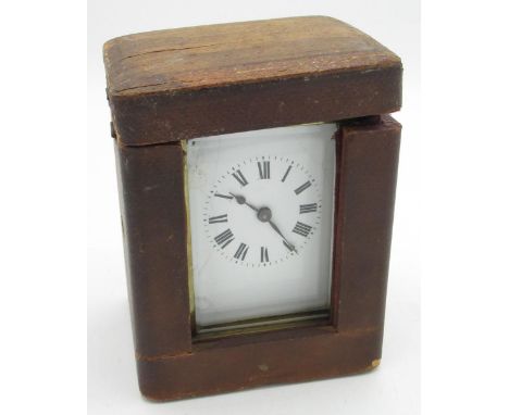 Early C20th brass cased carriage clock timepiece, white enamel Roman dial, visible platform lever escapement together with as