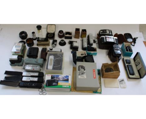 Selection of miniature cameras and selection of camera lenses, accessories, filters, light meters, rangefinders and other sma