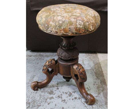 Victorian walnut tripod music stool upholstered top on three carved supports, H51cm 