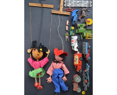 Two Pelham Puppets, a collection of vintage diecast vehicles from Dinky, Chad Valley and Tri-Ang and metal Britain's farm ani