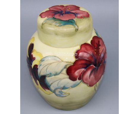 Moorcroft Pottery: Hibiscus pattern ginger jar and cover, tubelined decoration of yellow and burgundy flowers on graduating l