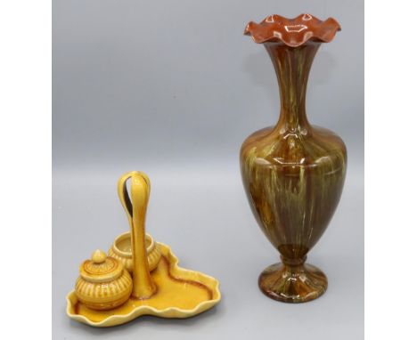 Linthorpe pottery mustard yellow glazed three piece cruet, trefoil base with pierced handle, 1202 &amp; 1893, and a streaked 