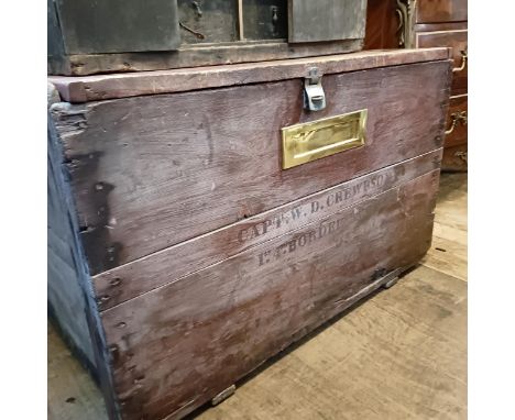 A stained pine trunk, inset with a brass letterbox, stenciled Capt W D Crewdson..., 101 cm wide