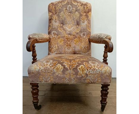 A 19th century walnut framed button back armchair