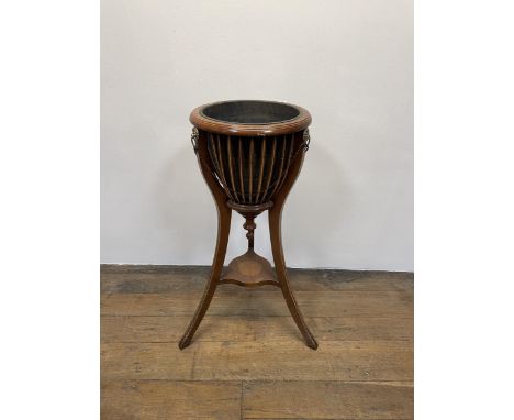 A mahogany planter, with a glass liner, 36 cm diameter