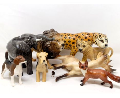 A Beswick Leopard, 1082, a Lion, 1506, a Lion Cub, 2098, an Elephant, 974, a Fox, 1440, a Stag, 981, a Beagle, 1939, and a La