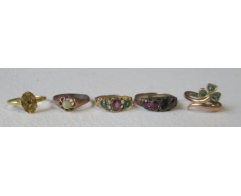 A Victorian 15ct ring, the oval head set single ruby, marked '15ct', together with a 9ct ring, with clover leaf set, three em