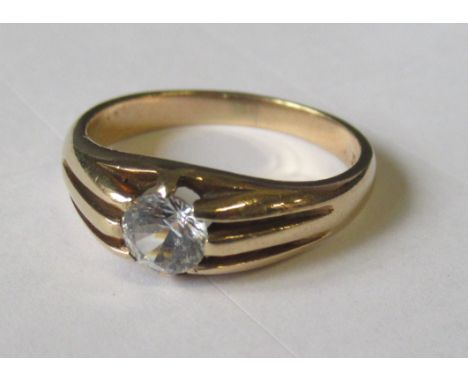 A 9ct gold ring, set with a single diamond, weight 3.8g
