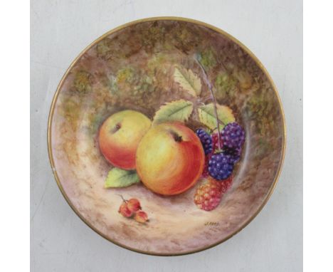 A Royal Worcester circular pin dish, decorated with fruit to a mossy background by J Reed