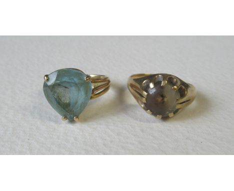 A 14k aquamarine ring, set single pear shape between triple shoulders, stamped 14k, weight 5.4g and a 9ct ring set citrine (w