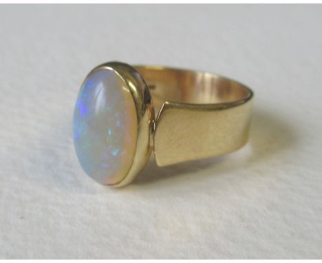 A 9ct gold ring, set with an opal, weight 4.5g