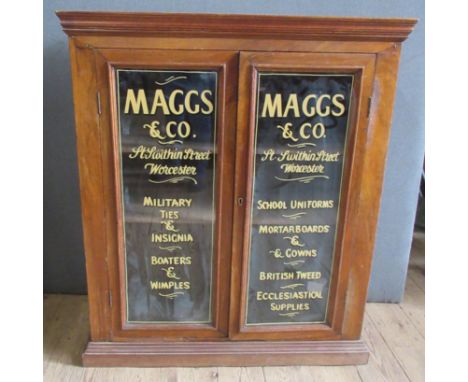 A glazed display cabinet, with Maggs and Co. St Swithuns Street, Worcester, 33ins x 14ins, height 39ins