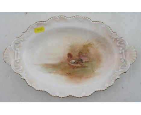 A Royal Worcester oval dish, decorated with ducks in landscape by Jas Stinton, diameter 12.5ins