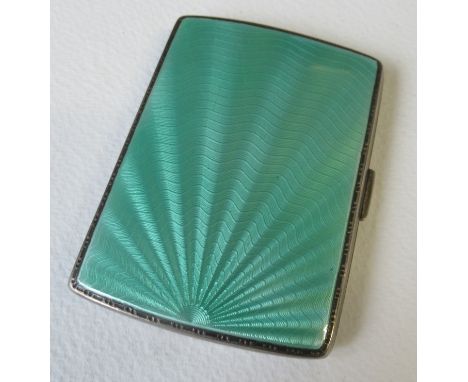 An Edward VIII silver and guilloche enamel cigarette case, with green starburst enamel to the front and presentation inscript