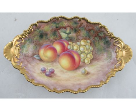 A Royal Worcester oval shaped dish, decorated with fruit to a mossy background by H Aryton, with gilt gadrooned shaped edge, 