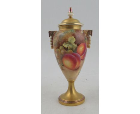 A Royal Worcester covered pedestal vase, decorated all around with fruit to a mossy background by Leaman, shape number 2710/3