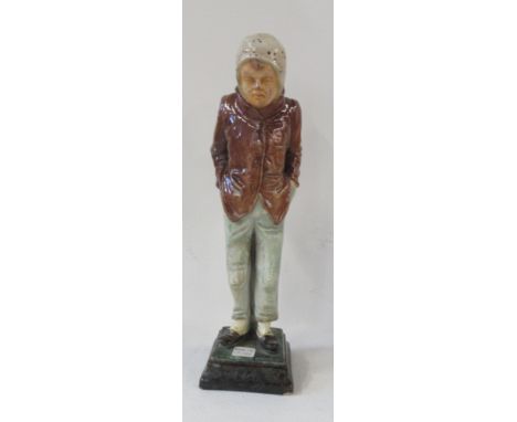 A 19th century Wayte &amp; Ridge majolica figure, of a man with his hands in his pockets, marked W&amp;R, height 9ins