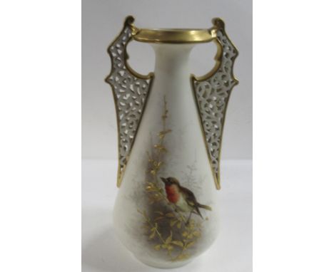 A Grainger &amp; Co Worcester ivory vase, with pierced handles, decorated with a Robin on gilt foliage, height 8insCondition 