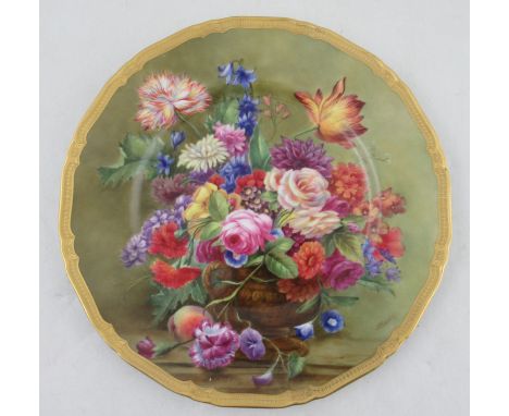 A Royal Worcester cabinet plate, decorated with a still life of flowers by E Barker, diameter 10.5ins