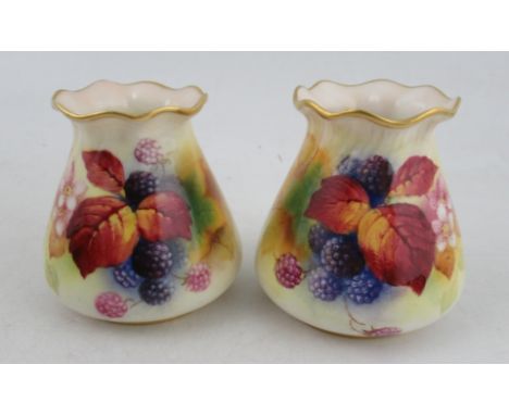 A pair of Royal Worcester vases, decorated with autumnal leaves, flowers and fruit by Kitty Blake, shape numbers G957, height