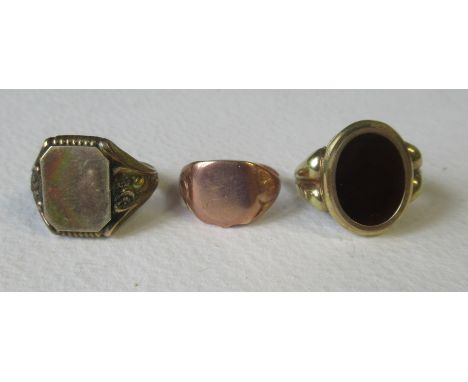 A 9ct rose gold signet ring, weight 3.5g and two yellow metal signet rings&nbsp;