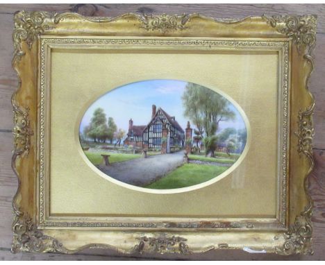 An oval Royal Worcester framed porcelain plaque, decorated with a view of Huddington Court by Harry Davis, diameter 9ins&nbsp