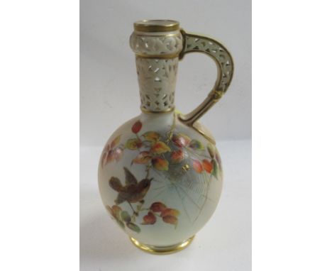 A Grainger &amp; Co Worcester ivory vase, with pierced neck and handle, decorated with a bird on a branch with spiders web, h