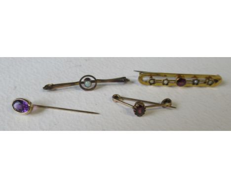 A 9ct garnet and pearl bar brooch, together with a gold garnet pin stick pin and 9ct brooch set opal, approx. 5.5g total&nbsp