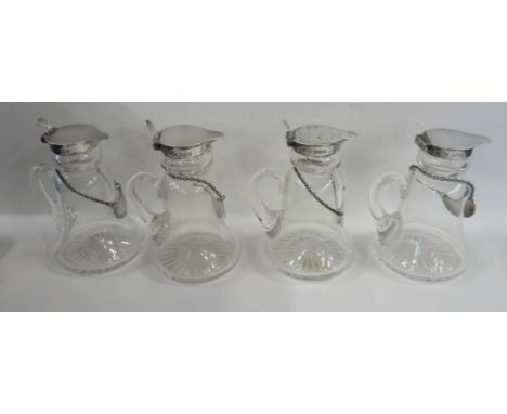 A set of four Asprey glass and silver whisky tots, each with silver Whisky labelCondition Report:  All in good condition&nbsp