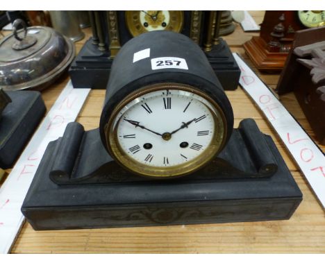 A VICTORIAN BLACK SLATE MANTEL CLOCK WITH WHITE ENAMEL DIAL 