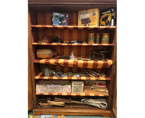 A VINTAGE TOBACCO TIN, THREE RETRO ELECTRONIC GAMES, TWO CAMERAS, VINTAGE SUITCASE, A GWR MARKED 100 ROLL HOLDER, VARIOUS COL