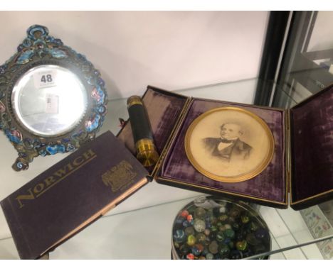 AN ANTIQUE ENAMELED DESK MIRROR, TOGETHER WITH A CASED PORTRAIT FRAME, A EXTENDING TELESCOPE AND POSTCARDS ETC 