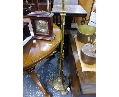 AN ANTIQUE BRASS STANDARD LAMP