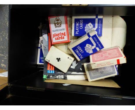 A TIN CASH BOX CONTAINING MAGIC AND OTHER PLAYING CARDS