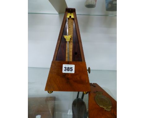A VICTORIAN WALNUT METRONOME. 