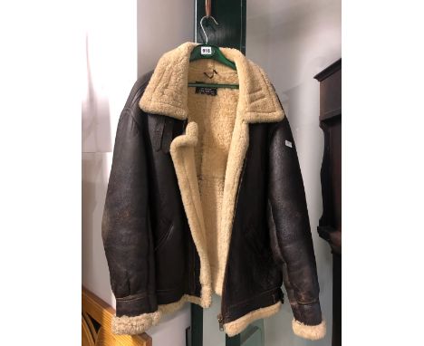 A VINTAGE SHEEP SKIN LINED FLYING JACKET