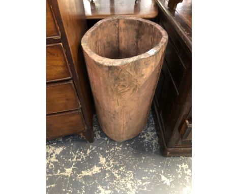 A LARGE RUSTIC DUG OUT WOOD STICK STAND 