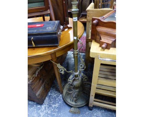 AN ANTIQUE BRASS STANDARD LAMP