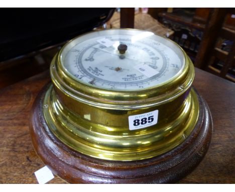 A BRASS CASED WALL BAROMETER