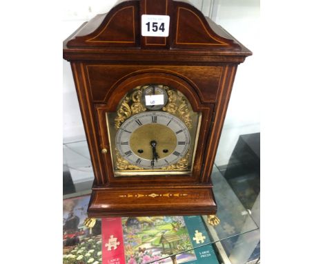 A LINE INLAID MAHOGANY CASED MANTLE CLOCK CHIMING ON TWO COILED RODS