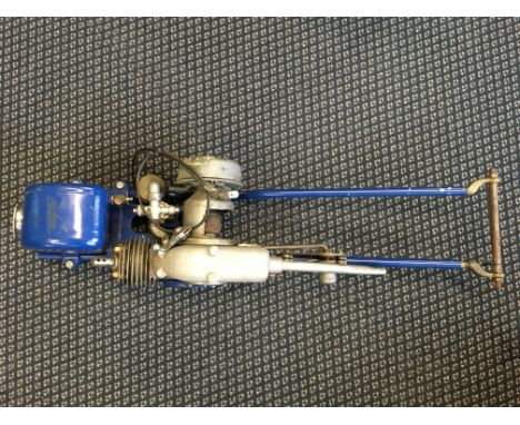 A Wico Mark Bantamag blue painted front mounting bicycle engine.